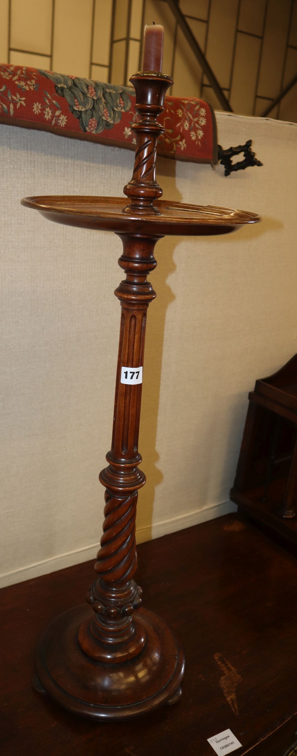 A Victorian carved walnut candlestand with mid tier, H.90cm